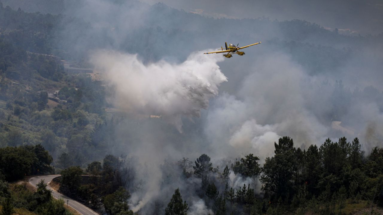 Portugal is grappling with extreme drought, while airplanes quell wildfires in Ourém, north of Lisbon.