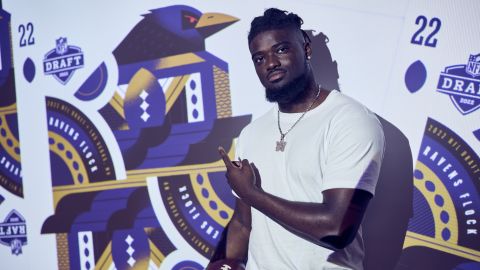Ojabo points to the Ravens logo after being drafted.