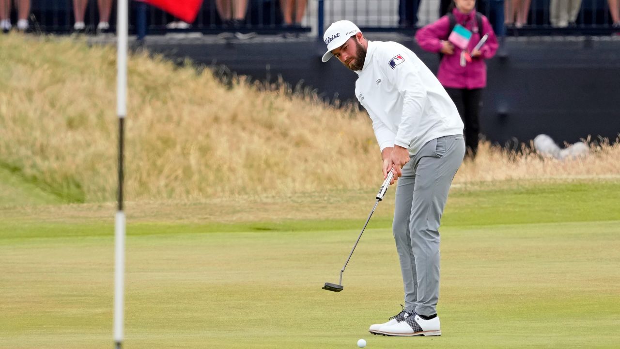Young putts on the 13th green.