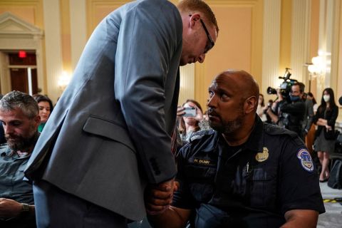 Stephen Ayres shakes hands with US Capitol Police officer Harry Dunn on Tuesday, July 12, after <a href="http://www.cnn.com/2022/06/09/politics/gallery/january-6-hearings/index.html" target="_blank">Ayres gave testimony</a> to the House select committee investigating <a href="http://www.cnn.com/2022/01/03/politics/gallery/january-6-capitol-insurrection/index.html" target="_blank">last year's attack on the Capitol.</a> Ayres was one of the Capitol rioters on January 6, 2021. Dunn was one of the officers who defended the Capitol that day.