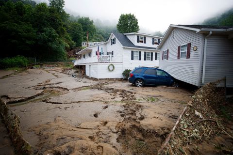A house that was moved off its foundation following a flash flood rests on top of a vehicle in Whitewood, Virginia, on Thursday, July 14. Six inches of rain in just hours <a href="https://www.cnn.com/2022/07/14/weather/buchanan-county-virginia-floods-thursday/index.html" target="_blank">caused extensive damage</a> in rural Buchanan County.