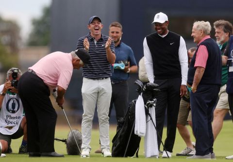 Four of golf's greatest players — from left, Lee Trevino, Rory McIlroy, Tiger Woods and Jack Nicklaus — share a lighthearted moment during the Celebration of Champions, a four-hole tournament held Monday, July 11, in St. Andrews, Scotland. St. Andrews is hosting the Open Championship this week.