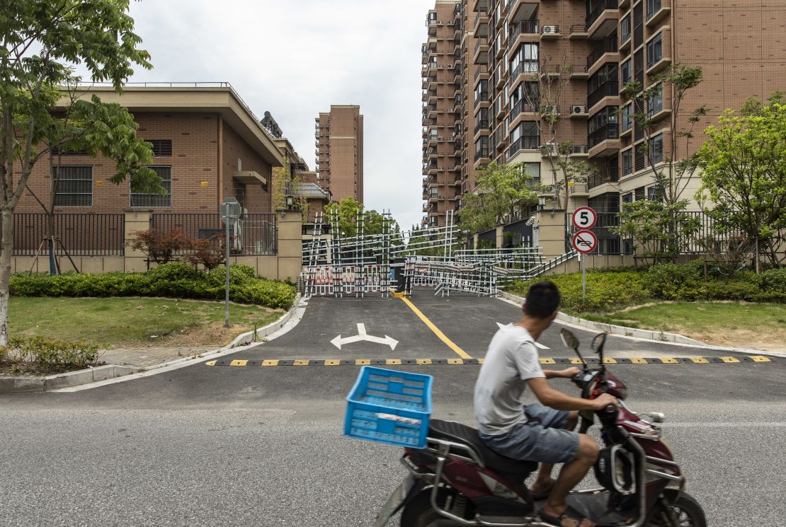 Barricades from recent Covid-related lockdowns block an entrance leading to Country Garden Holdings Co.'s Fengming Haishang residential development in Shanghai, China, on Tuesday, July 12, 2022. 