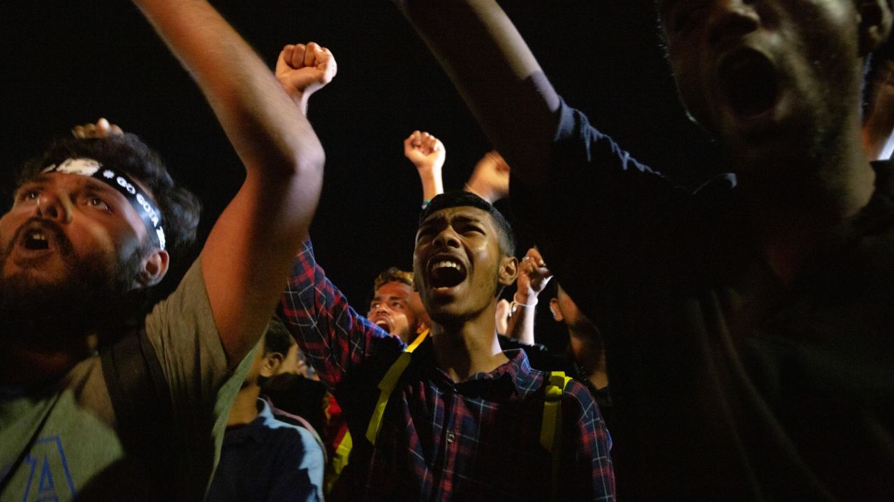 People celebrate in Colombo, Sri Lanka, upon learning about the resignation of President Gotabaya Rajapaksa on July 14.
