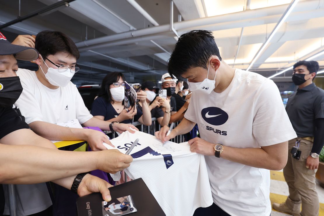 Son signs autographs during Spurs' training session at Goyang Stadium on July 10 in South Korea.