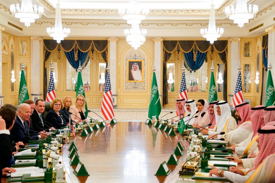 Biden and his delegation, left, sit down with the Crown Prince and his team for talks at the palace.