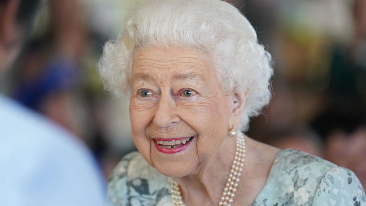 The Queen smiles on her Friday visit.