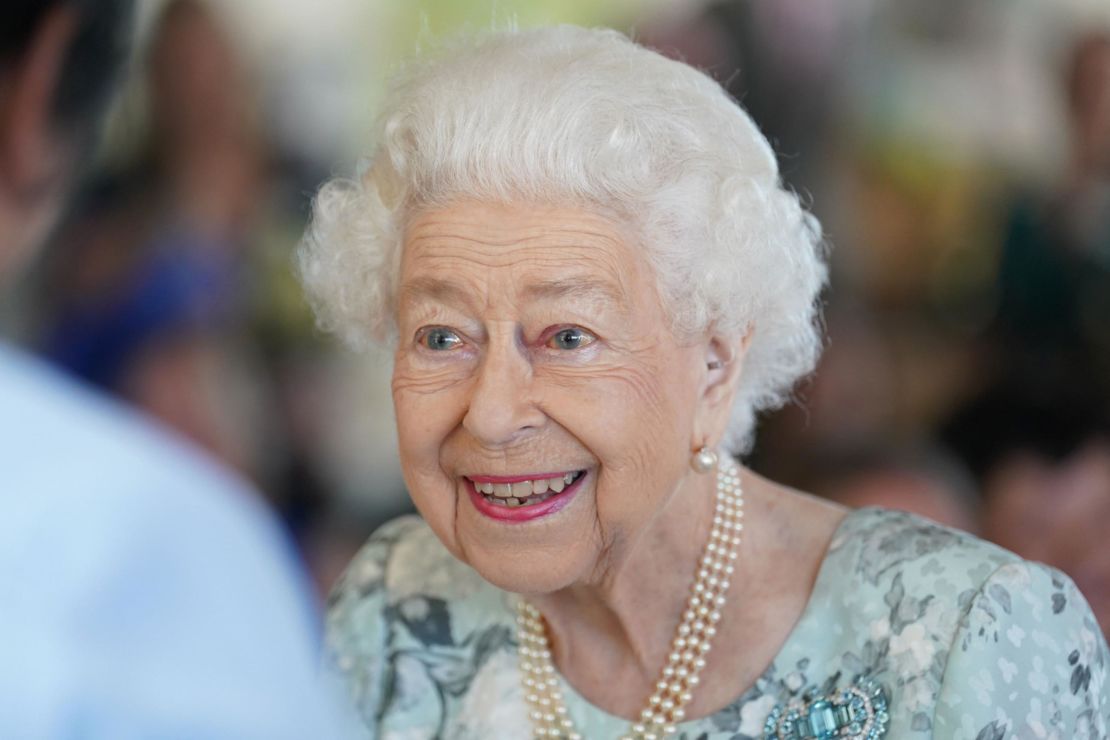 The Queen smiles on her Friday visit.