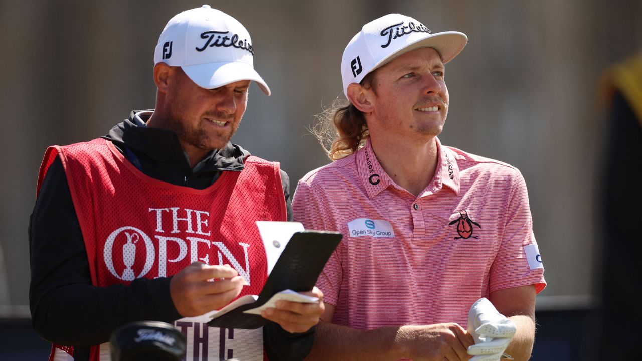 Smith with his caddie at the 2nd tee.