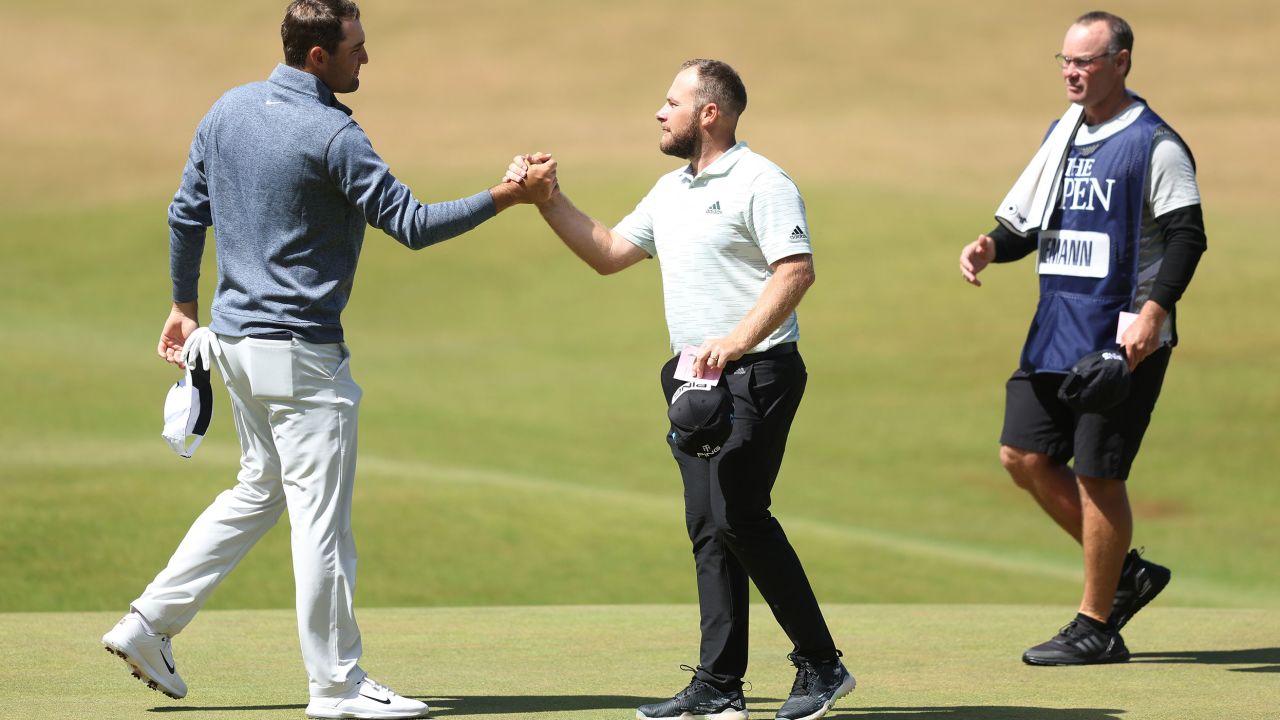 Hatton (R) shakes hands with Scheffler following their round.