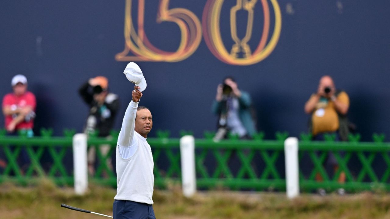 Woods waves to the crowd on the 18th green at the 150th Open Championship at St Andrews in July.