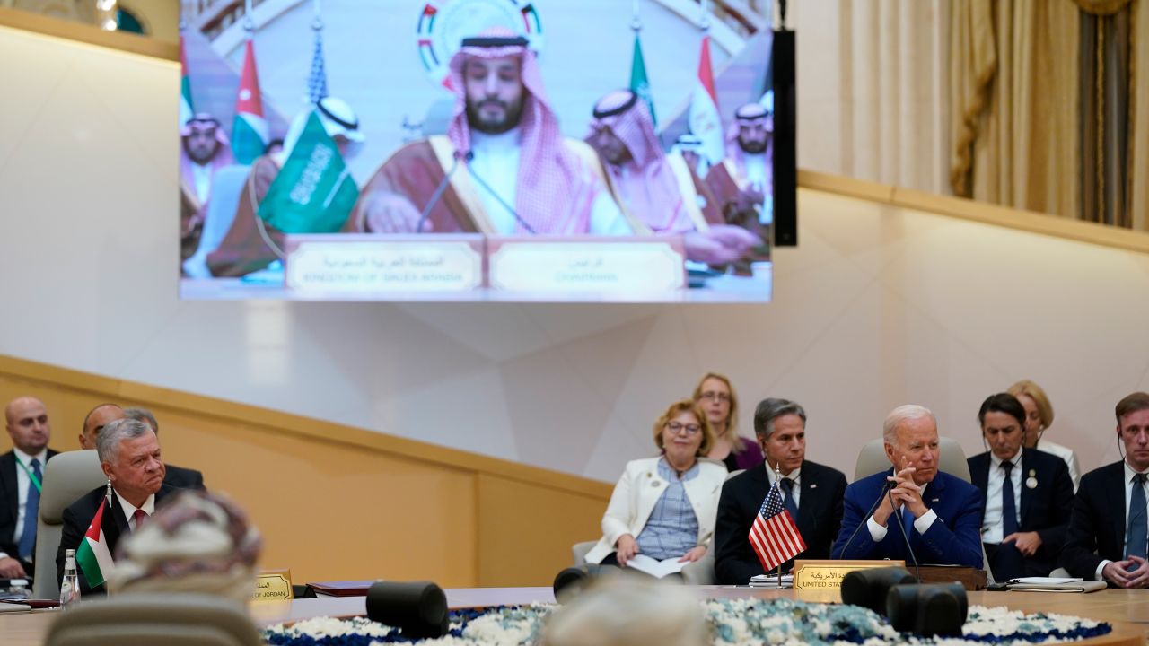 President Joe Biden listens to Saudi Crown Prince Mohammed bin Salman, on the screen, during the Gulf Cooperation Council Saturday, July 16, 2022, in Jeddah, Saudi Arabia. 