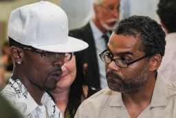 Vincent Ellerbe, left, and Thomas Malik, right, talk with the press following their exoneration hearing at Brooklyn Supreme Court on July 15, 2022, in New York.