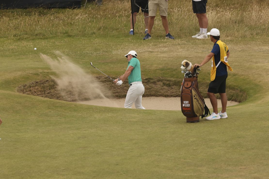 McIlroy holes from the bunker at the 10th for eagle.