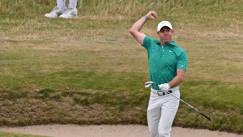 McIlroy reacts to his eagle from the bunker.