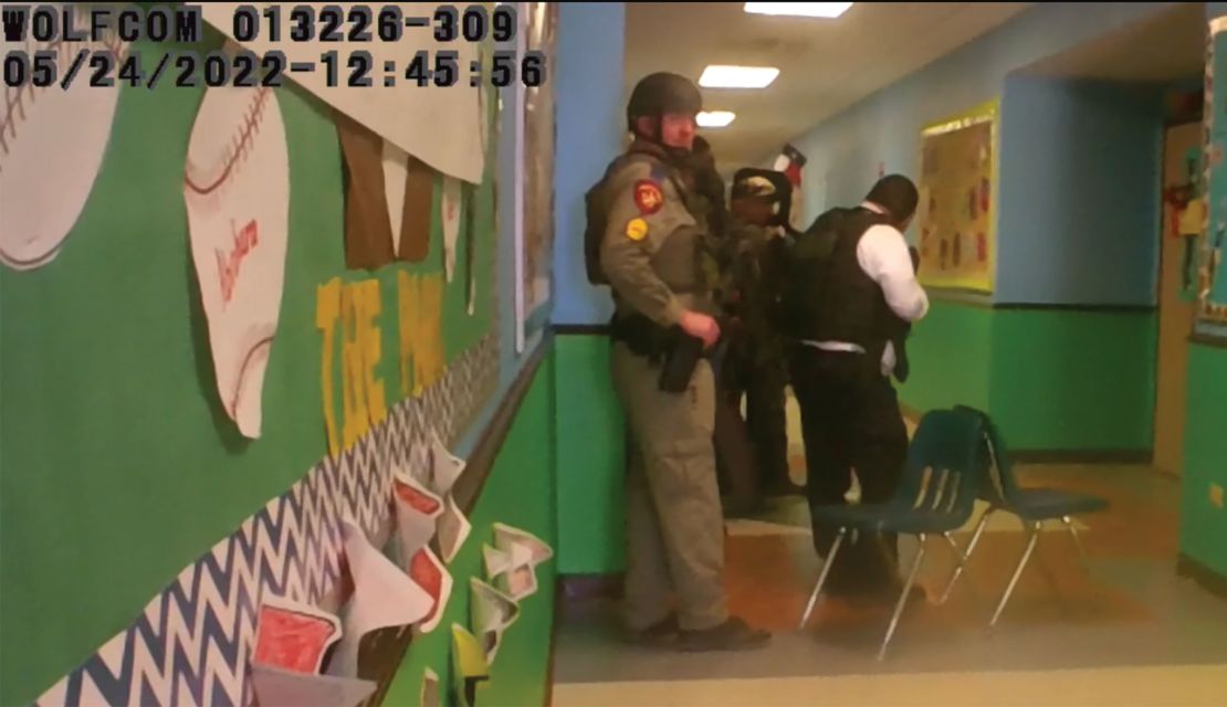 This photo released by the Texas House of Representatives Investigative Committee on the Robb Elementary Shooting responders stack in hallway south of Rooms 111 & 112.