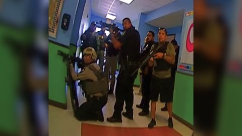 This photo released by the Texas House of Representatives Investigative Committee on the Robb Elementary Shooting shows responders positioned in north end of a hallway in Robb Elementary.