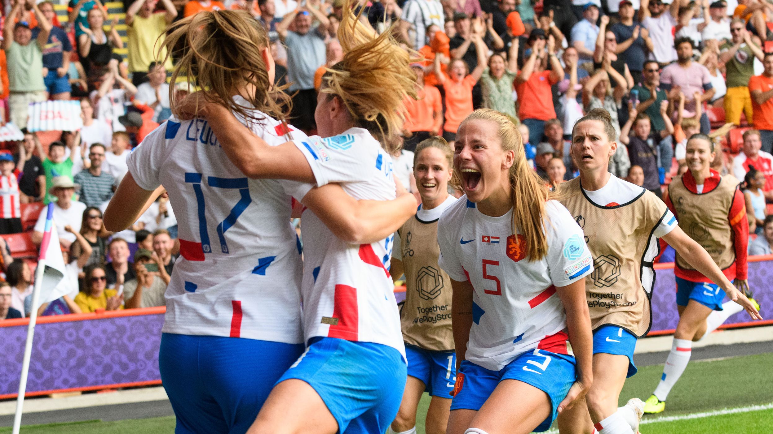 Leuchter celebrates with her teammates after scoring against Switzerland.