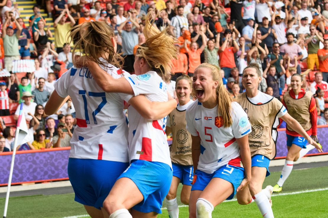 Leuchter celebrates with her teammates after scoring against Switzerland.