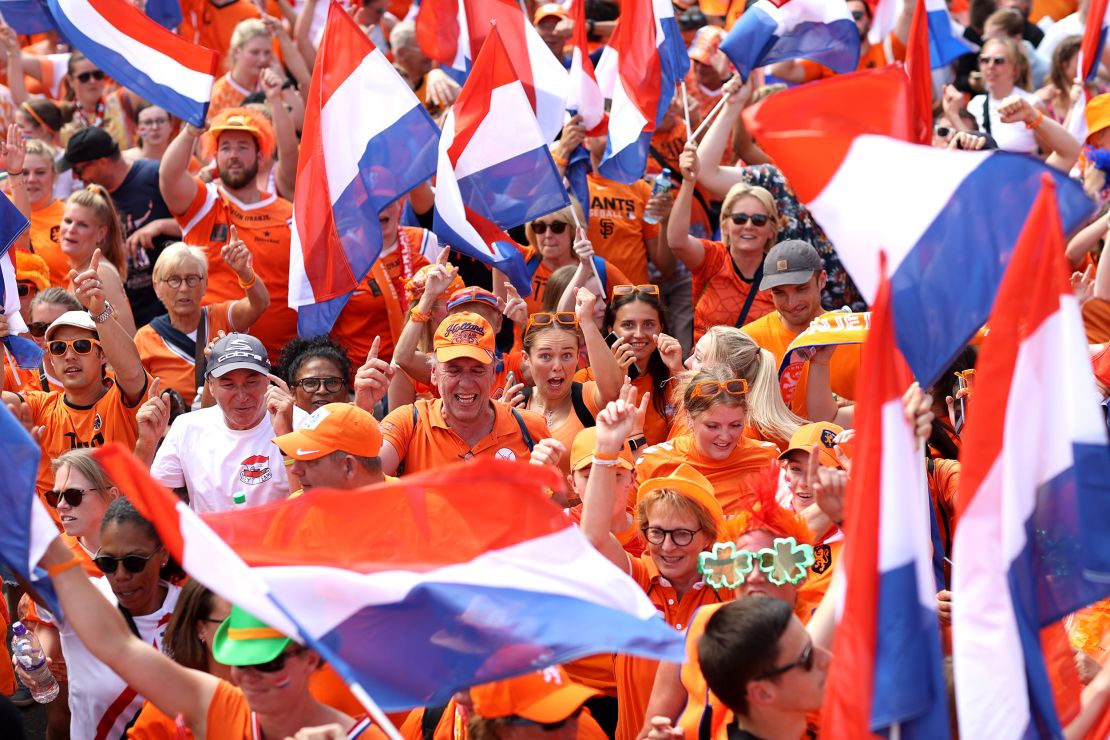 Netherlands fans show their support on the way to the stadium for the team's game against Switzerland.
