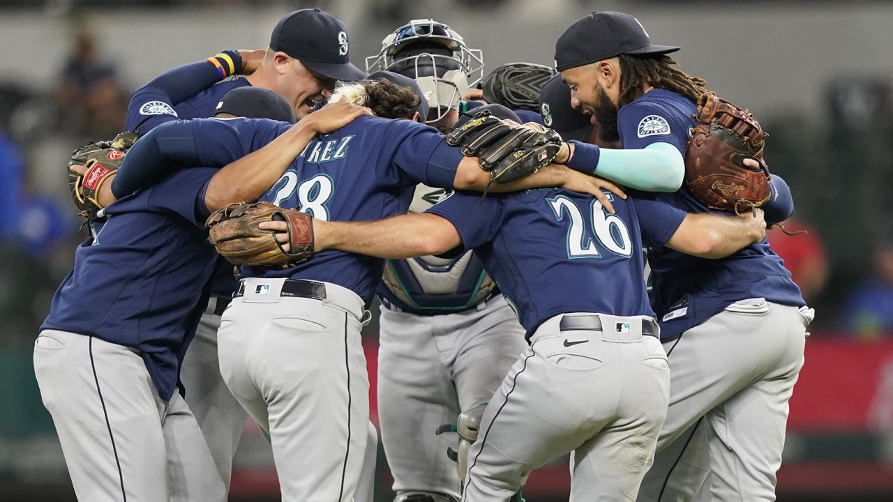 The Seattle Mariners celebrate victory against the Texas Rangers.
