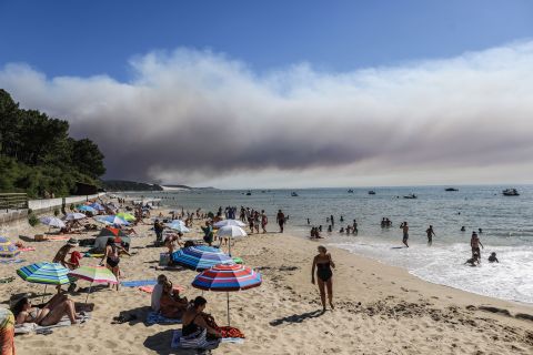A cloud of smoke rises from the Dune of Pilat, in the Arcachon basin of southwest France, on July 13.