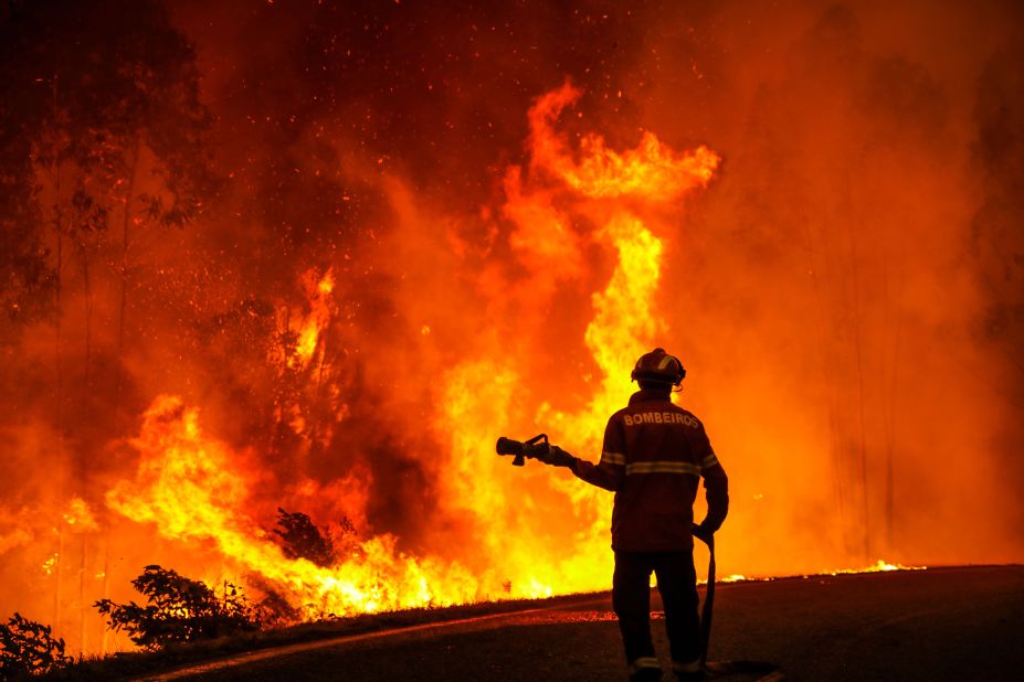 A wildfire burns forest near the Portuguese village of Memoria on July 12.