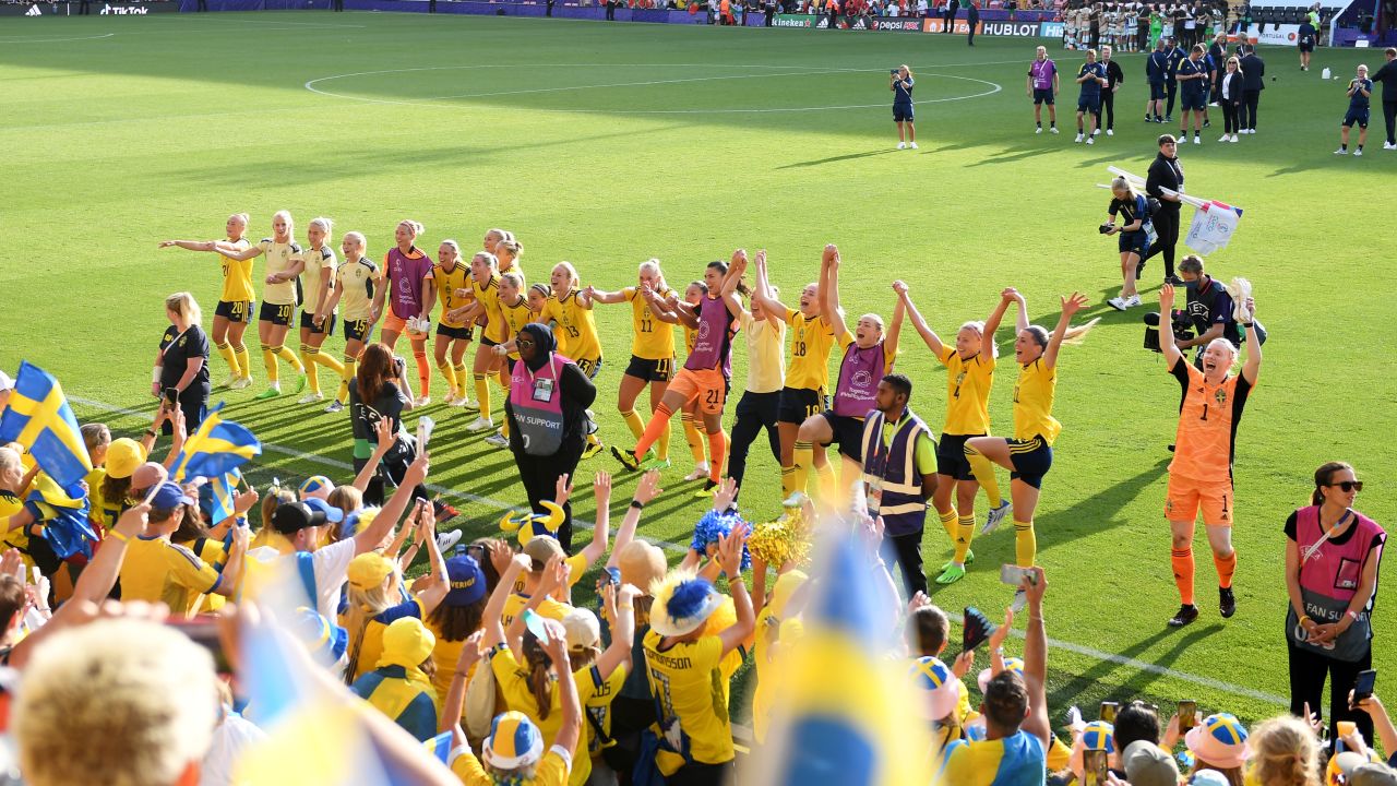Sweden players celebrate with the fans after beating Portugal.