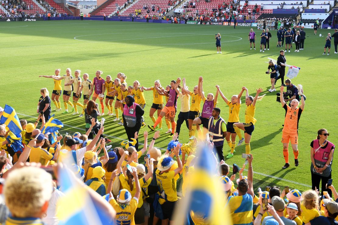 Sweden players celebrate with the fans after beating Portugal.