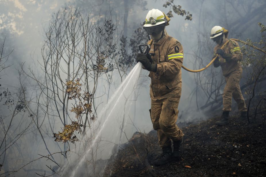 Firefighters work in Rebolo, Portugal, on July 14.