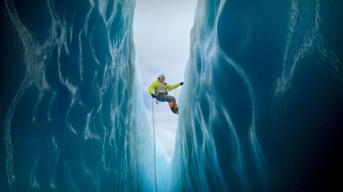 On the hunt for ice dragons, biologist Isaí Madríz climbs inside a crevasse.