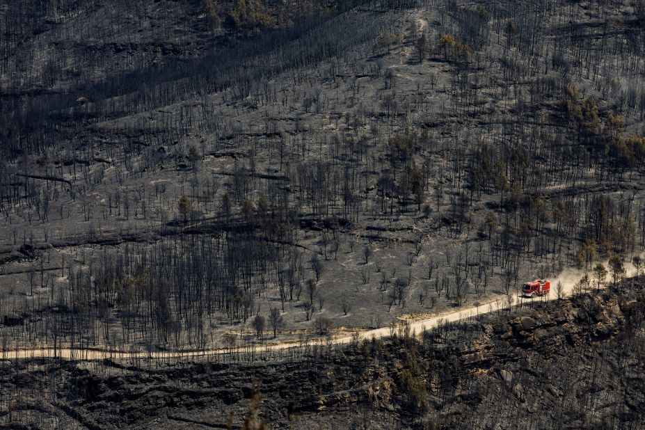 A fire engine is driven through El Pont de Vilomara, Spain, on July 18.