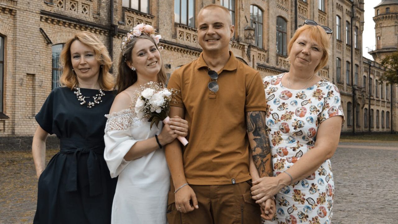 Vlada and her husband Ivan with their mothers on their wedding day.