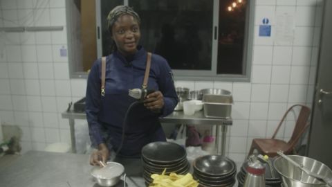 Fatmata Binta prepares a meal for guests of her Dine on a Mat experience in Accra, Ghana.