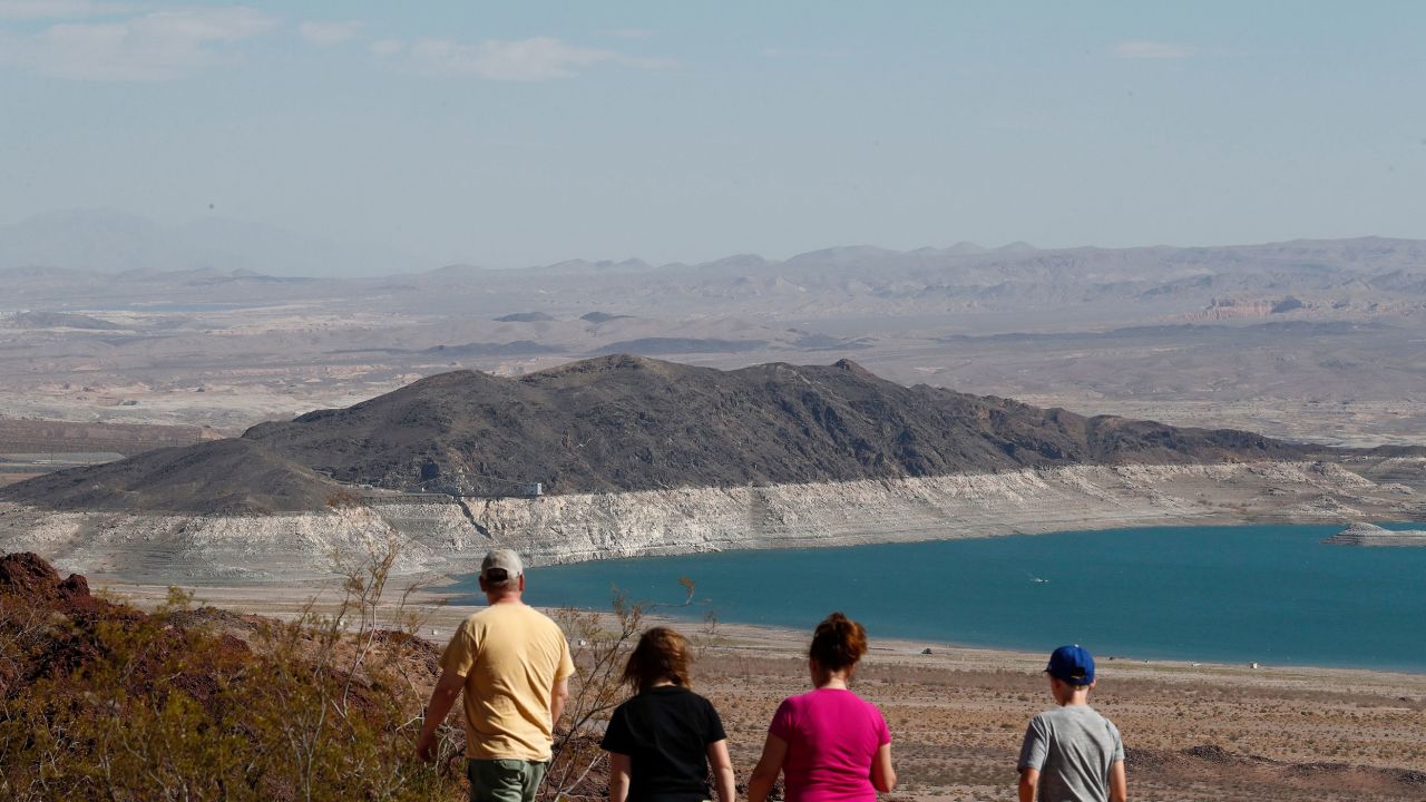 People look out at Lake Mead from the Overlook at Hoover Dam Lodge in Boulder City, Nevada, on June 30.