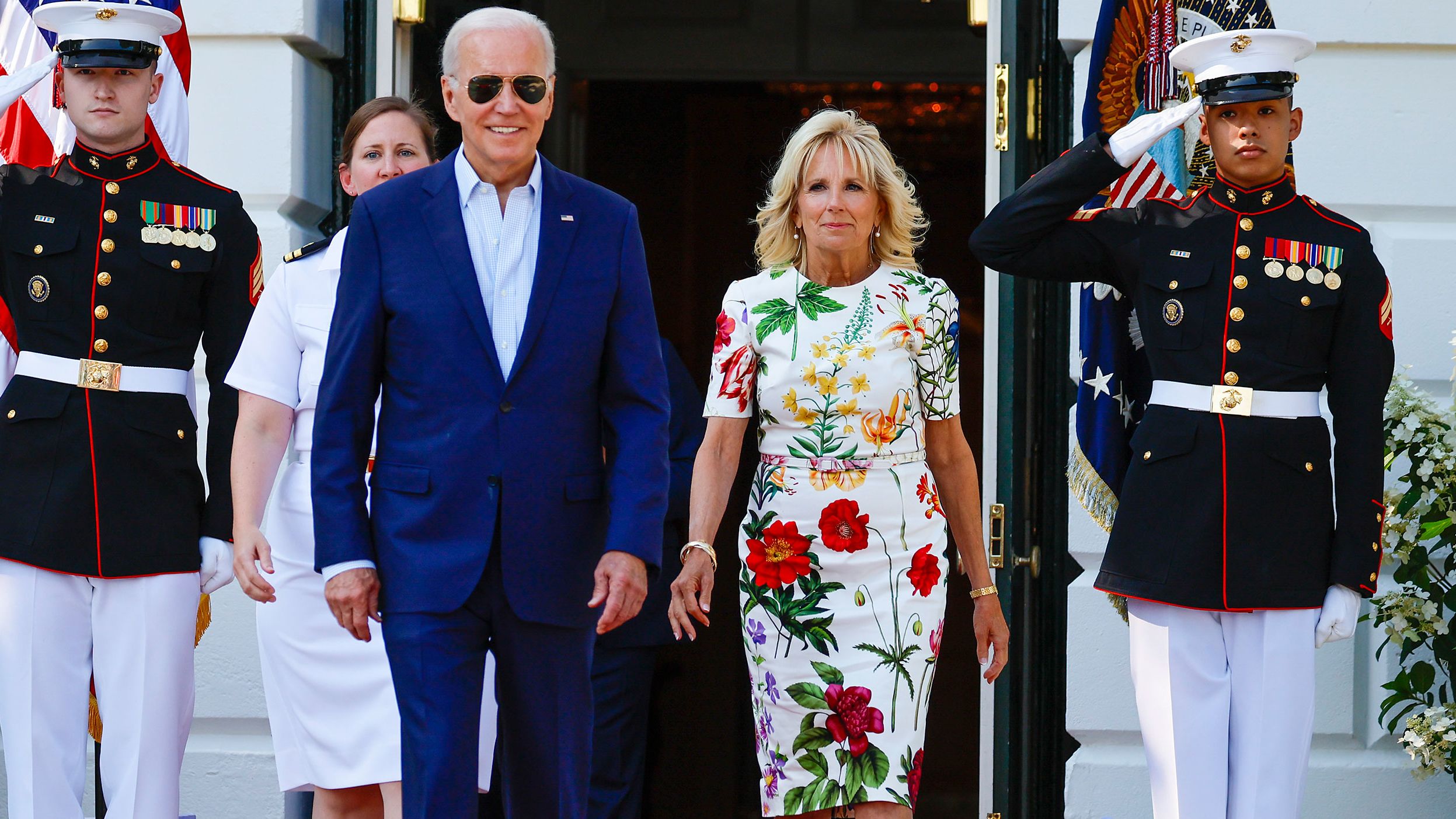 President Joe Biden and first lady Jill Biden walk out of the White House on July 4, 2022 in Washington.