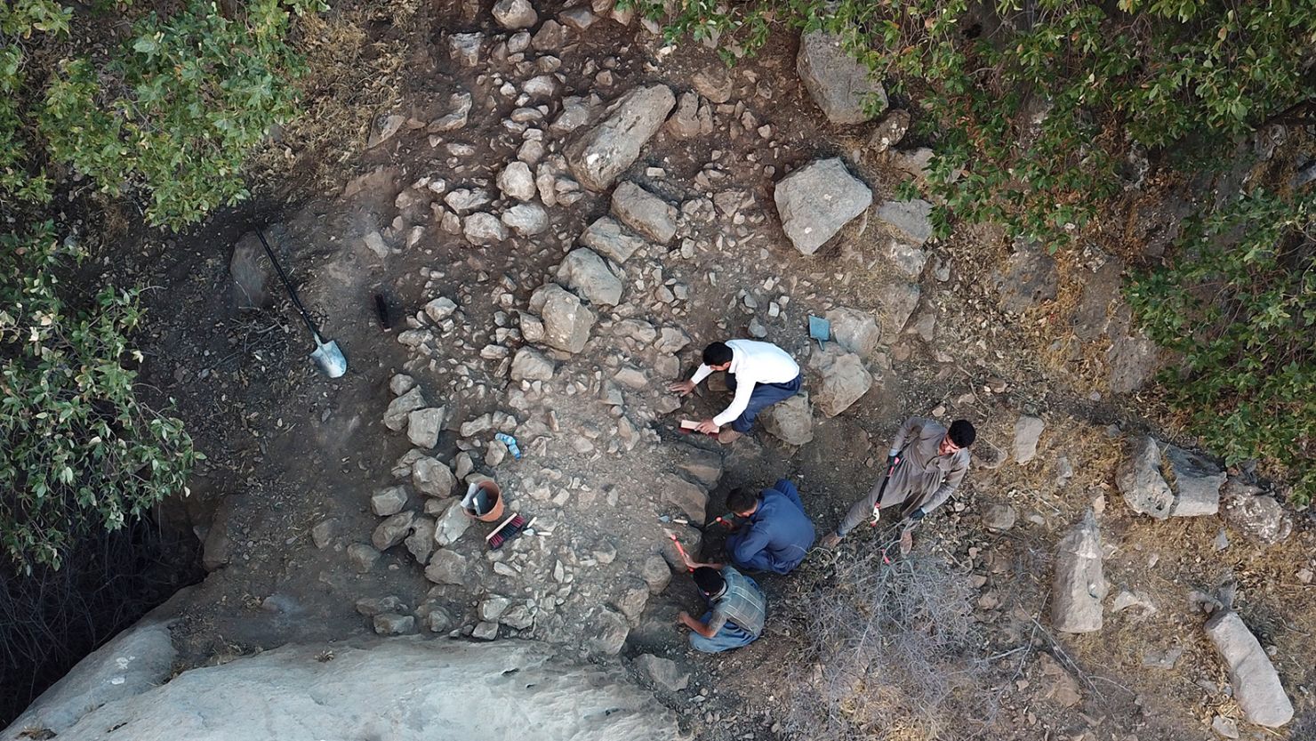 Researchers excavate the perimeter wall at the entrance to Rabana Valley in Iraqi Kurdistan.