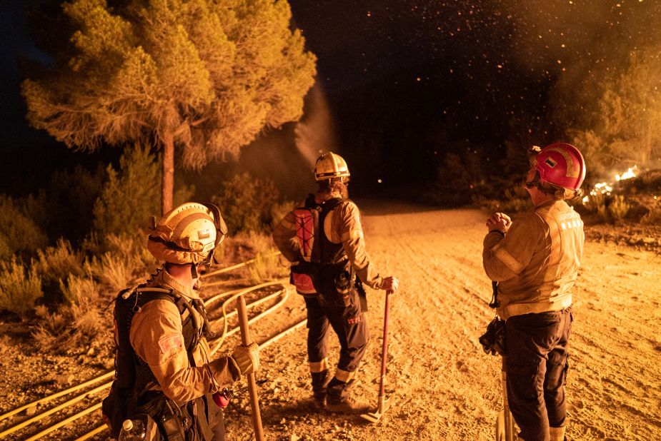 Firefighters take a break in Catalonia, Spain, on July 17.