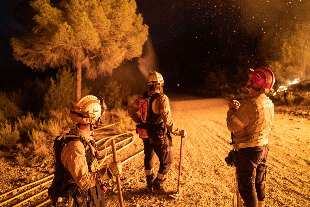 Firefighters take a break in Catalonia, Spain, on July 17.