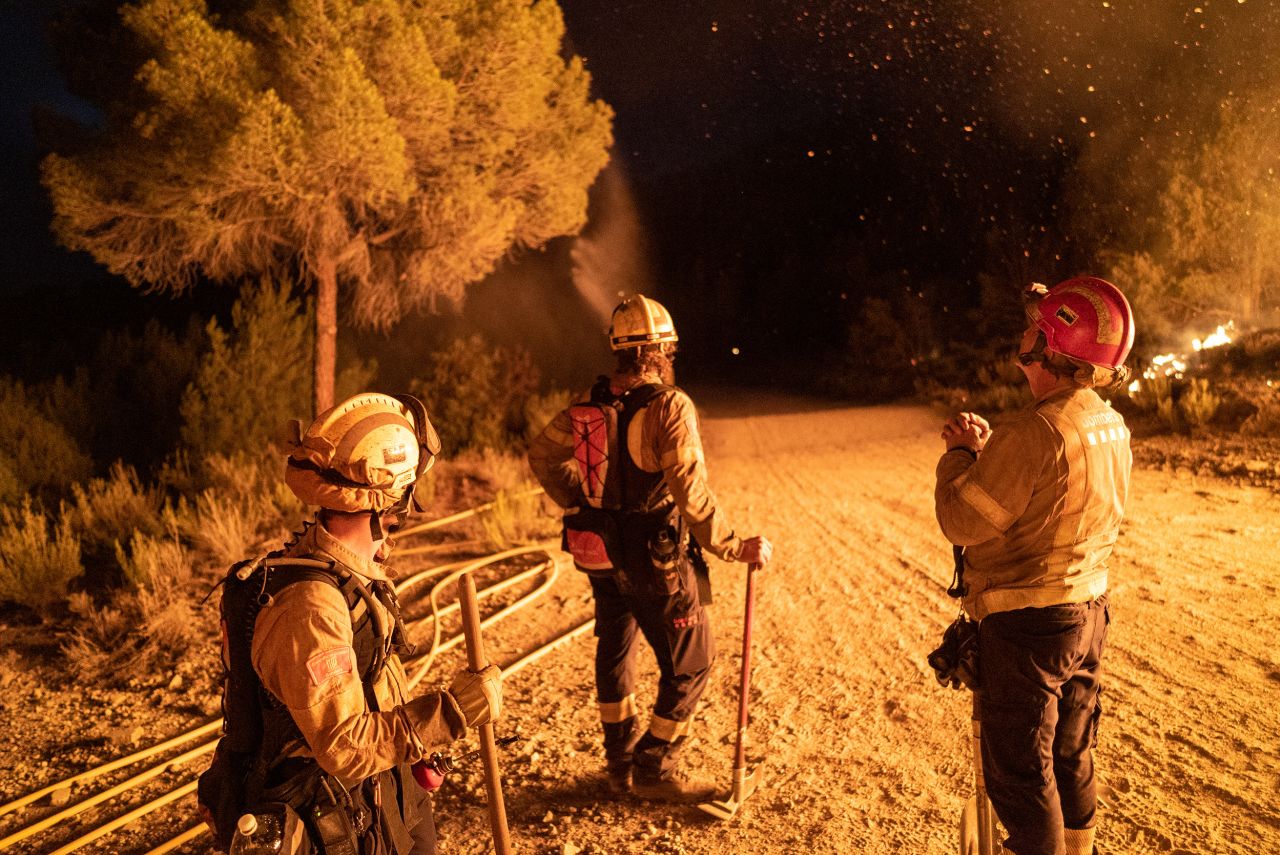 Firefighters take a break in Catalonia, Spain, on July 17.