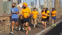 Simran Jeet Singh (pictured here in blue) running on the Brooklyn Bridge with Sikhs in the New York City running club.