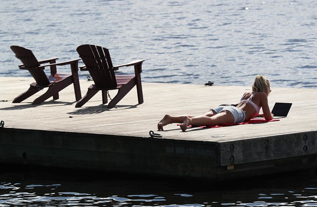 Boston, MA - Warm weather brought people out to the Esplanade in Boston in June.