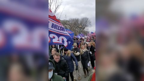 Courtney Holland, sixth from left behind the man in the hat, can be seen walking toward the US Capitol on January 6, 2021.