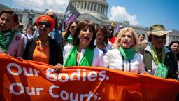 Democratic Reps. Nydia Velazquez, Ilhan Omar, Jackie Speier, Carolyn Maloney, Alma Adams and others march toward the US Supreme Court during a protest Tuesday.