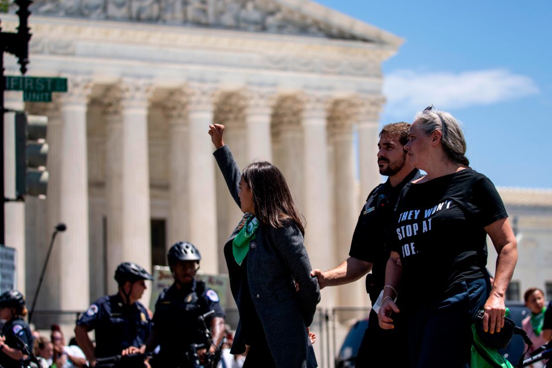 Rep. Alexandria Ocasio-Cortez is seen outside the Supreme Court of the United States during a sit-in protest on Capitol Hill on Tuesday.