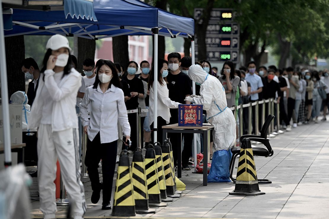 People queue at a Covid testing site in Beijing on June 13.