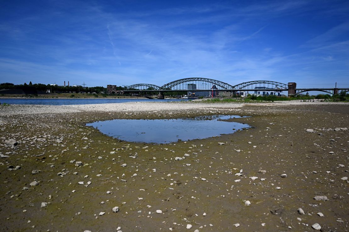 A puddle of water in the nearly dried-up river bed of the Rhine in Cologne, western Germany.