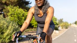 Attractive senior Black Woman Biking