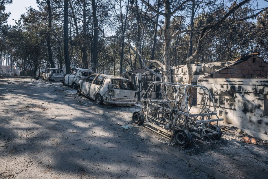 Burnt cars and trees are seen at a campsite in southwest France on July 19.
