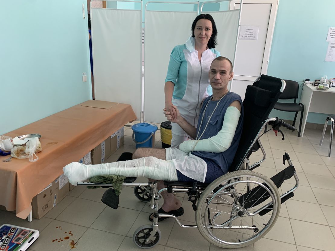 Alexey Nechipurenko poses with a doctor at a shelter for Ukrainian refugees in Taganrog, southern Russia.